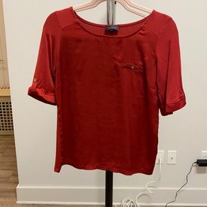 Rust colored blouse.